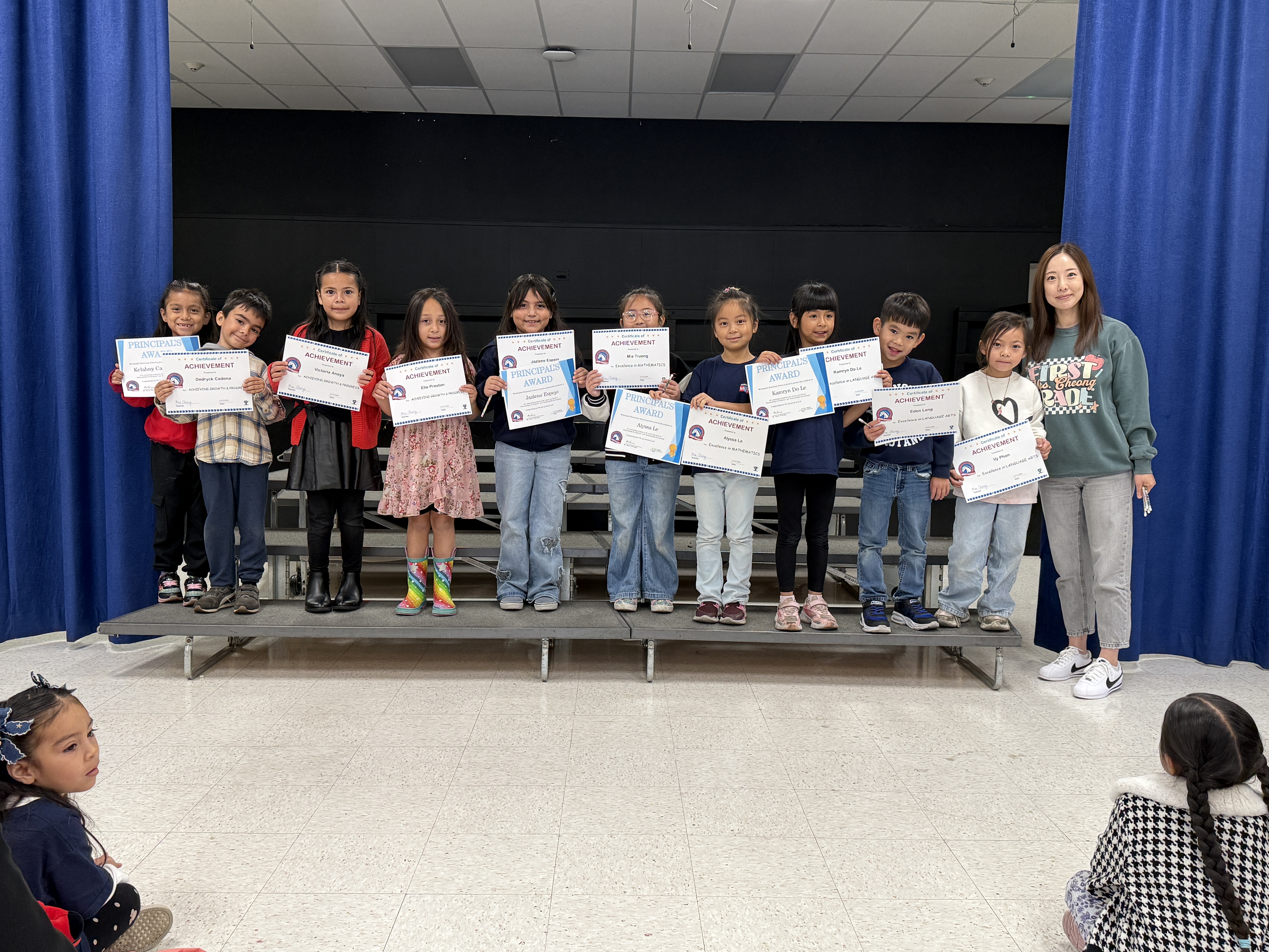 First Grade Mustangs Receiving Trimester Awards