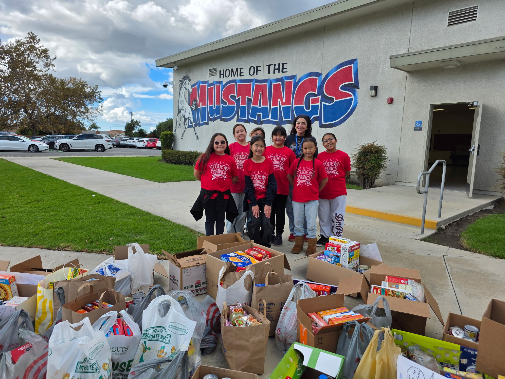 Mustangs Donating Food to The Monarcha Initiative